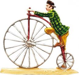 Mr. riding a penny-farthing 