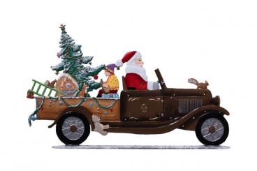 Der Weihnachtsmann unterwegs im Oldtimer 