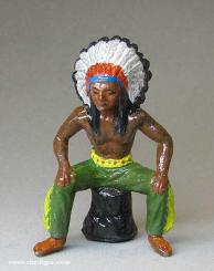 Indian chief, sitting on tree stump 