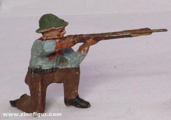 Cowboy kniend schießend 